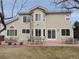 Expansive backyard featuring a patio with seating, perfect for outdoor relaxation and entertaining at 21024 E 49Th Ave, Denver, CO 80249