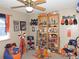 Broncos themed bedroom featuring sports memorabilia and team colors at 21024 E 49Th Ave, Denver, CO 80249