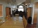 Bright dining area with an oval table set for eight, and overlooks the living room at 21024 E 49Th Ave, Denver, CO 80249