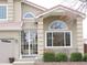 Close up of front exterior showcasing stucco and unique architectural details at 21024 E 49Th Ave, Denver, CO 80249