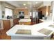 A lovely kitchen area featuring an island, stainless steel appliances, and lots of counter space at 21024 E 49Th Ave, Denver, CO 80249