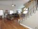 View of living room showcasing the hardwood floors and staircase at 21024 E 49Th Ave, Denver, CO 80249