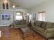 Bright and airy living room featuring hardwood floors, high ceilings and stylish decor at 21024 E 49Th Ave, Denver, CO 80249