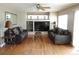 Comfortable living room with hardwood floors, decorative pillows and a large flatscreen TV at 21024 E 49Th Ave, Denver, CO 80249