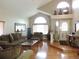 Inviting living room featuring a vaulted ceiling and large front window at 21024 E 49Th Ave, Denver, CO 80249