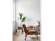 Well-lit living room corner with a brown chair, side table, decorative baskets, and stylish decor at 4023 E Martin Luther King Jr, Denver, CO 80207