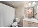 Clean bathroom with a white vanity, modern fixtures, and a shower with curtain at 14602 E 2Nd Ave # 110C, Aurora, CO 80011