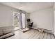 Bright bedroom with a large window, desk area, and comfortable space for pets or hobbies at 14602 E 2Nd Ave # 110C, Aurora, CO 80011