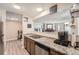 Functional kitchen featuring stainless steel appliances, granite countertops, and a view into the living space at 14602 E 2Nd Ave # 110C, Aurora, CO 80011