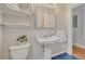 Bathroom boasts vintage style sink and blue tile flooring at 132 W Bayaud Ave, Denver, CO 80223