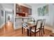Cozy dining area features hardwood floors and a seamless connection to the adjacent kitchen at 132 W Bayaud Ave, Denver, CO 80223