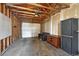 Spacious garage interior with concrete floor, overhead door and storage cabinets at 132 W Bayaud Ave, Denver, CO 80223