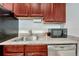 Kitchen boasts granite countertops, microwave, and stainless steel dishwasher at 132 W Bayaud Ave, Denver, CO 80223