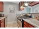 Kitchen featuring stainless steel appliances, granite countertops, and ample cabinet space at 132 W Bayaud Ave, Denver, CO 80223