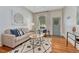 Inviting living room featuring hardwood floors, comfortable seating, and stylish decor at 132 W Bayaud Ave, Denver, CO 80223