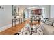 Open-concept living room with hardwood floors, stylish decor, and a seamless flow to the kitchen at 132 W Bayaud Ave, Denver, CO 80223