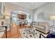 Bright living room features hardwood floors and an open layout leading to the kitchen and dining area at 132 W Bayaud Ave, Denver, CO 80223