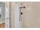 Walk-in shower with sleek matte fixtures and subway tile surround at 132 W Bayaud Ave, Denver, CO 80223