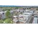 An aerial view showcasing a multi-unit complex set against a backdrop of scenic landscapes and cityscapes at 364 S Ironton St # 425, Aurora, CO 80012