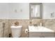 Cozy bathroom features marble tile, modern vanity, decorative mirror, and upgraded fixtures at 364 S Ironton St # 425, Aurora, CO 80012