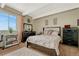 Comfortable bedroom boasts plush carpet, large window, and tasteful decor at 364 S Ironton St # 425, Aurora, CO 80012