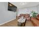 Inviting living room featuring leather sofas, stylish decor, and a wall-mounted TV for entertainment at 364 S Ironton St # 425, Aurora, CO 80012