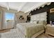 Spacious main bedroom boasts designer headboard, king bed, and unique hexagonal wall design at 364 S Ironton St # 425, Aurora, CO 80012