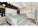 Spacious main bedroom boasts designer headboard, king bed, and unique hexagonal wall design at 364 S Ironton St # 425, Aurora, CO 80012