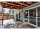 Back deck and sliding glass doors leading to living area, snow on the ground at 3719 S Ensenada St, Aurora, CO 80013