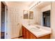 Double vanity bathroom with mirrored medicine cabinets at 1225 Briarhollow Way, Highlands Ranch, CO 80129