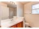 Clean bathroom with single sink vanity and shower at 1225 Briarhollow Way, Highlands Ranch, CO 80129