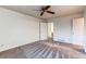 Well-lit bedroom with ceiling fan and carpet flooring at 1225 Briarhollow Way, Highlands Ranch, CO 80129