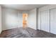 Bedroom with double door closet and access to bathroom at 1225 Briarhollow Way, Highlands Ranch, CO 80129