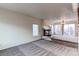 Bright living room with fireplace and view to backyard deck at 1225 Briarhollow Way, Highlands Ranch, CO 80129