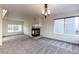 Living room with fireplace and carpet flooring at 1225 Briarhollow Way, Highlands Ranch, CO 80129