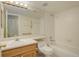 Simple bathroom with shower/tub combo and wood vanity at 23619 Genesee Village Rd # B, Golden, CO 80401