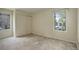 Well-lit bedroom featuring a large closet and a window with a view at 23619 Genesee Village Rd # B, Golden, CO 80401