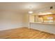 Open concept dining area with hardwood floors and kitchen at 23619 Genesee Village Rd # B, Golden, CO 80401