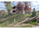 Exterior view of a two-story building on a hillside at 23619 Genesee Village Rd # B, Golden, CO 80401