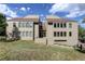 Tan two-story building with multiple units and landscaping at 23619 Genesee Village Rd # B, Golden, CO 80401