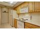 Kitchen with white appliances and oak cabinets at 23619 Genesee Village Rd # B, Golden, CO 80401