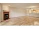 Spacious living room with hardwood floors and fireplace at 23619 Genesee Village Rd # B, Golden, CO 80401