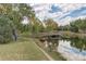 Scenic pond with a gazebo in a park-like setting at 23619 Genesee Village Rd # B, Golden, CO 80401