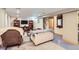 Cozy finished basement with comfortable seating area, stairs, and a TV with bookshelves at 218 E Colorado Ave, Berthoud, CO 80513