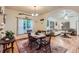 Charming dining room with rustic wood table, natural light, and hardwood floors at 218 E Colorado Ave, Berthoud, CO 80513