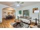 Open-concept living room flowing into the dining area, with hardwood floors and neutral tones at 218 E Colorado Ave, Berthoud, CO 80513