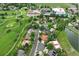 An aerial view showcasing the neighborhood amenities including a pool, tennis court, and clubhouse at 11621 Shoshone Way, Denver, CO 80234