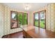 Breakfast nook features a large table and multiple windows with views at 11621 Shoshone Way, Denver, CO 80234