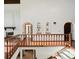 Bright hallway showcasing arched doorways, built-in shelving, and staircase at 11621 Shoshone Way, Denver, CO 80234
