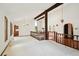 Spacious living room with vaulted ceilings, wooden beams, and ample natural light at 11621 Shoshone Way, Denver, CO 80234